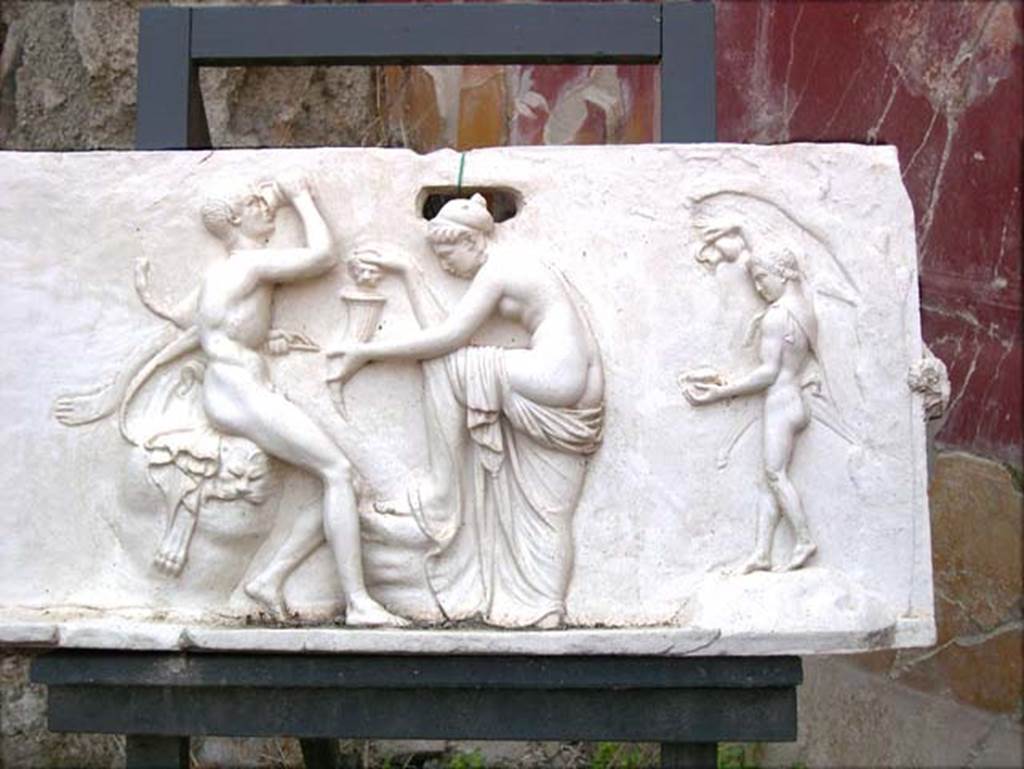 House of Dionysiac Reliefs, Herculaneum. July 2004. Dionysian marble relief found in 1997, showing two Satyrs and a Nymph.
Photo courtesy of Jennifer Stephens.©jfsPAP_Frieze0687